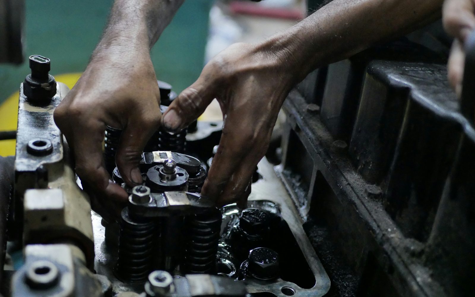 Mechanic working on a truck engine